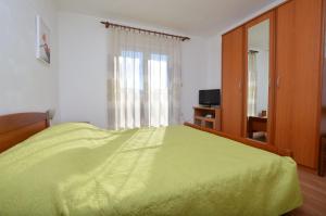 Postel nebo postele na pokoji v ubytování Apartments Marija