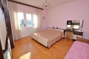 Postel nebo postele na pokoji v ubytování Apartments Marija