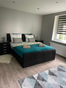 Ein Bett oder Betten in einem Zimmer der Unterkunft Apartmány Klicperka