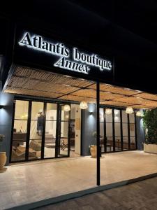 a building with a sign that readsatlantis boutique alliance at Atlantis Boutique ΑΝΝΕX in Rhodes Town