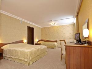 Posteľ alebo postele v izbe v ubytovaní Hotel Fajkier