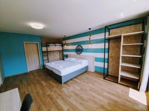 Postel nebo postele na pokoji v ubytování Apartmány Petrov, Baťův kanál