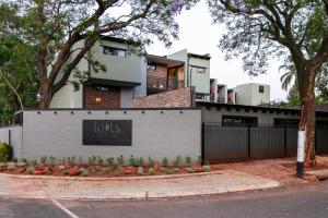 a building with a lotts sign in front of it at Menlyn Lofts in Pretoria