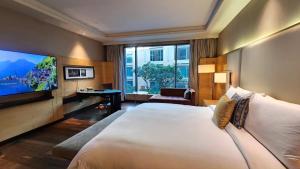 Postel nebo postele na pokoji v ubytování JW Marriott Hotel Chandigarh