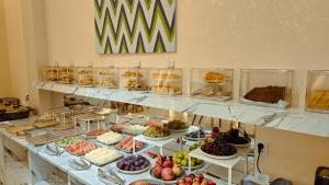 a buffet filled with lots of different types of food at Hotel Bankir Khiva in Khiva