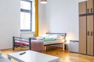A bed or beds in a room at Near Danube & Millenium Tower - Massive Shared 4BR Apt