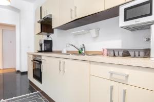 A kitchen or kitchenette at Near Danube & Millenium Tower - Massive Shared 4BR Apt
