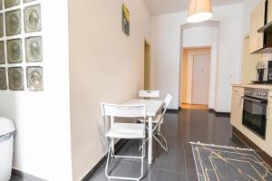 A kitchen or kitchenette at Near Danube & Millenium Tower - Massive Shared 4BR Apt