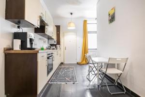 A kitchen or kitchenette at Near Danube & Millenium Tower - Massive Shared 4BR Apt