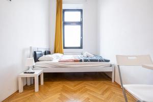 A bed or beds in a room at Near Danube & Millenium Tower - Massive Shared 4BR Apt