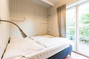 Ένα ή περισσότερα κρεβάτια σε δωμάτιο στο Inselhaus EG +34 φωτογραφίες