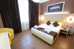 Postel nebo postele na pokoji v ubytování Hotel Giacosa
