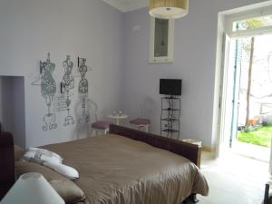 Postel nebo postele na pokoji v ubytování b&b I Limoni
