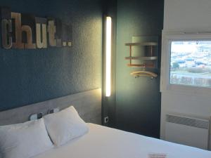 Postel nebo postele na pokoji v ubytování ibis Budget Le Treport Mers Les Bains