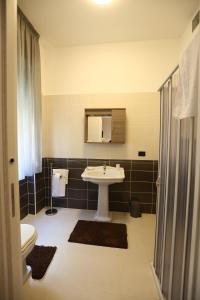 a bathroom with a sink and a toilet at Civico7 in Villa San Giovanni