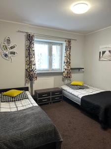 Posteľ alebo postele v izbe v ubytovaní APARTAMENT NAD KAMIEŃCZYKIEM II