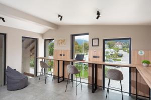 a home office with a large desk and stools at 7 Lakes camping in Sapareva Banya