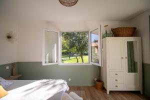 Postel nebo postele na pokoji v ubytování Gîte Le Chapitre