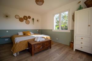 Postel nebo postele na pokoji v ubytování Gîte Le Chapitre