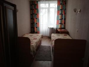 Postel nebo postele na pokoji v ubytování ГОТЕЛЬ Заводу 410 ЦА