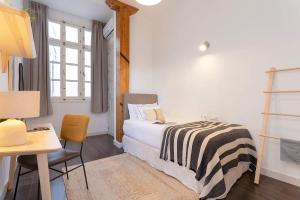 Posteľ alebo postele v izbe v ubytovaní Genteel Home Larios