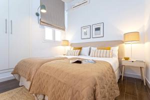Posteľ alebo postele v izbe v ubytovaní Genteel Home Larios
