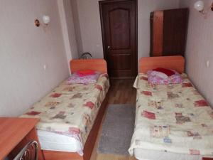 Postel nebo postele na pokoji v ubytování ГОТЕЛЬ Заводу 410 ЦА