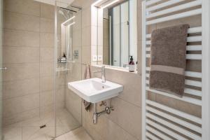 a bathroom with a sink and a shower at Apartment am Camping Dornbirn - 214 Staufen in Dornbirn