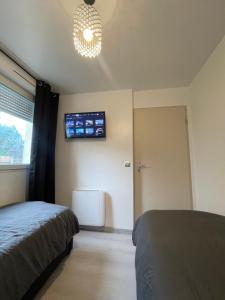Postel nebo postele na pokoji v ubytování Appartement 3 pièces à 5 minutes de la gare de Creil