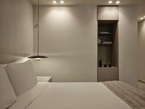 Postel nebo postele na pokoji v ubytování Doryssa Method Hotel
