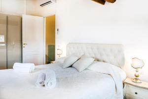 Postel nebo postele na pokoji v ubytování Evaluna Apartments