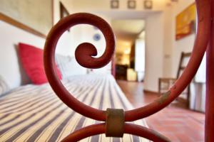a close up of the end of a bed at Palazzo Alavolini - the loft suite in Fano