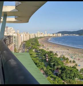a view of the beach from a balcony at Apart511 in Santos