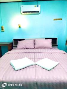 Ένα ή περισσότερα κρεβάτια σε δωμάτιο στο Alanta aonang resort