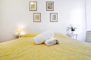a bedroom with a bed with two towels on it at Castellani Apartment in Florence