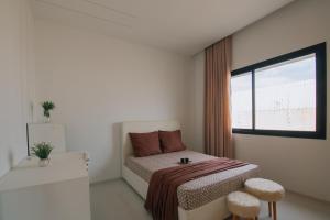 Postel nebo postele na pokoji v ubytování Villa UBUD Djerba sans vis a vis