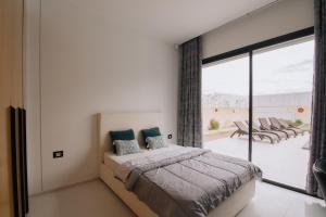 Postel nebo postele na pokoji v ubytování Villa UBUD Djerba sans vis a vis