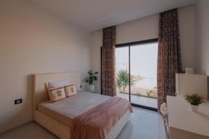 Postel nebo postele na pokoji v ubytování Villa UBUD Djerba sans vis a vis