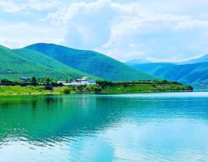 a view of a lake with mountains in the background at Camping SuperPanorama in Kukës