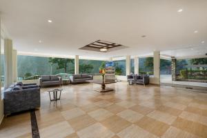 a large living room with couches and a table at Sterling Corbett in Marchula