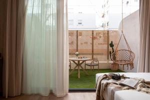 Postel nebo postele na pokoji v ubytování Nomad Haux Mestalla