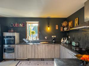 a kitchen with a sink and a counter top at Maison de campagne, deux chambres, vue sur les montagnes in Sartène