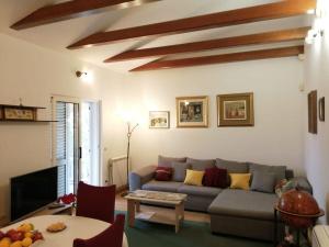 a living room with a couch and a table at House Mare in Kastel Novi