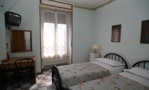 Postel nebo postele na pokoji v ubytování Hotel Eva