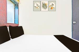 Postel nebo postele na pokoji v ubytování Hotel new shree niwas