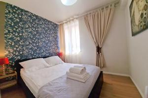 Łóżko lub łóżka w pokoju w obiekcie Lux Apartment Art