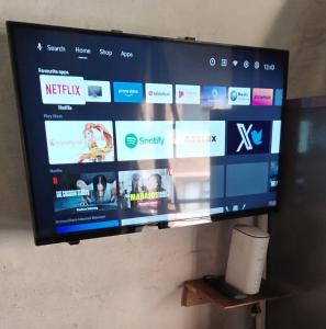 a flat screen tv hanging on a wall at 260 Jozi Maboneng - Uncapped Wi-Fi in Johannesburg