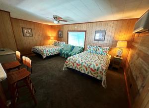 Ein Bett oder Betten in einem Zimmer der Unterkunft Sand Spur Cottages