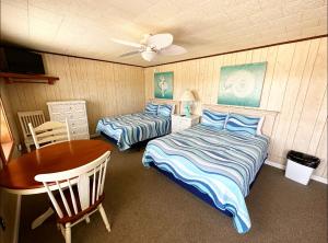 Ein Bett oder Betten in einem Zimmer der Unterkunft Sand Spur Cottages