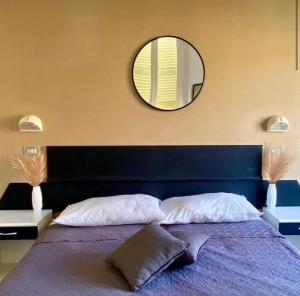Postel nebo postele na pokoji v ubytování Hotel Villa Pozzi